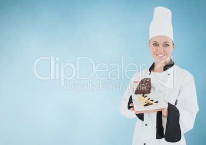 Chef with cake slice against blue background