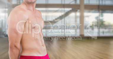 Composite image of Fitness man Torso against modern empty room