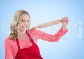 Woman with rolling pin against white background