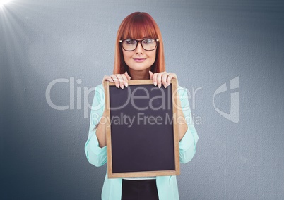 Composite image of Woman with blackboard against navy background