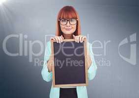 Composite image of Woman with blackboard against navy background