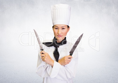 Composite image of Chef with knives against white background