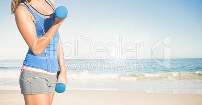 Composite image of woman Fitness Torso against sea