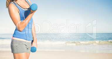 Composite image of woman Fitness Torso against sea