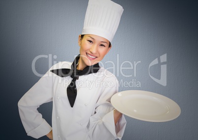 Chef with plate against grey background