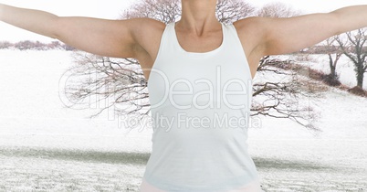 Fitness woman making fitness exercises with a countryside background