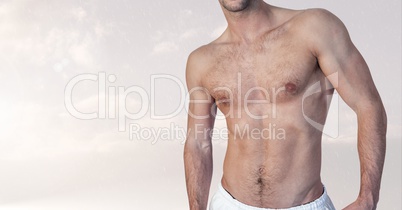 Fitness man torso against cloud background