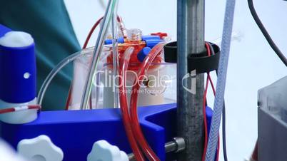 Heart lung machine pumping blood in operating room