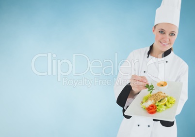 Chef with plate of food against blue background