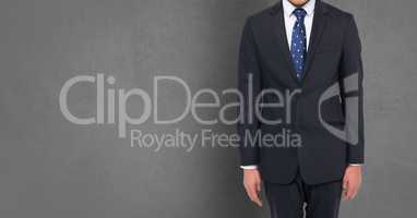 Composite image of Businessman Torso against grey background