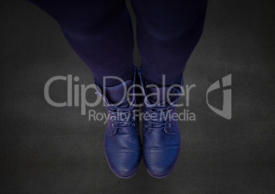 Composite image of Blue shoes on dark concrete