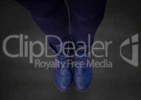 Composite image of Blue shoes on dark concrete