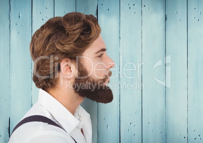 Man with beard against blue wood panel