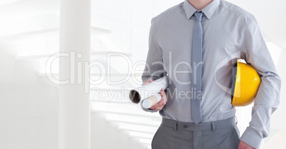 Architect Torso holding a cask and plan in front of steps