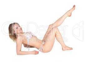 Woman lying on floor in bikini.