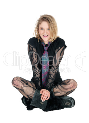 Beautiful young woman sitting on floor.