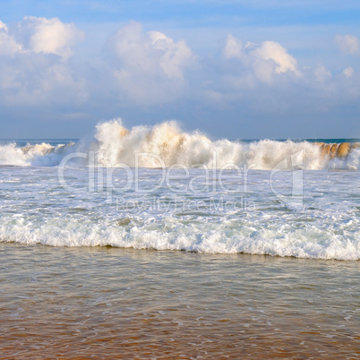 ocean, sandy beach and blue sky