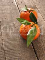 Two fresh organic orange fruits