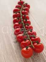 Organic tomatoes on wood