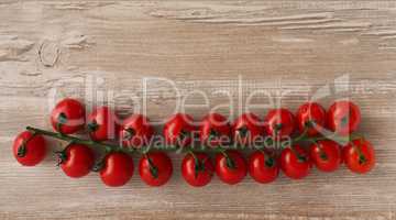 Fresh cherry tomatoes on wood