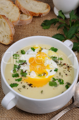 potato cream soup with poached eggs