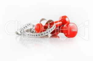 Dumbbells and measuring tape