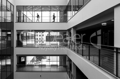 Modern interior and two people walking