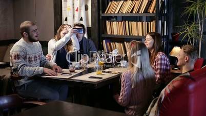 Restful teenage friends enjoying in the cafe.