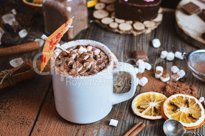 cup of hot chocolate with marshmallows sprinkled with cocoa