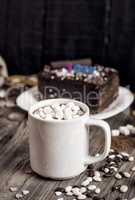 White mug with marshmallows and a drink