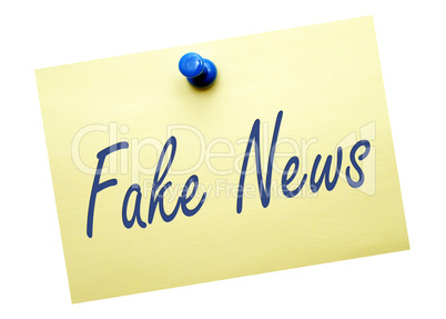 Fake News - yellow note paper on white background
