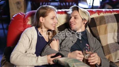 Joyful loving couple spending leisure in cafe