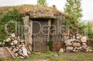 Ground cellar with wooden door