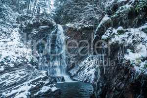 Winter waterfall in forest