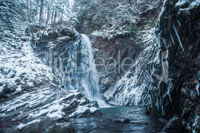 Winter waterfall in forest