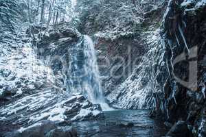 Winter waterfall in forest
