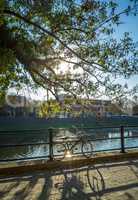 Bicycle on the embankment of river