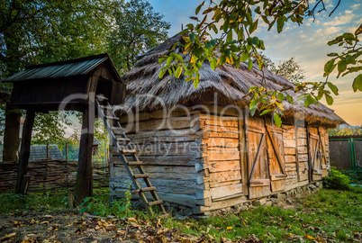 Ukrainian traditional village buildings at autumn.