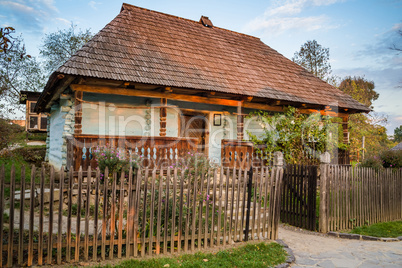 Ukrainian traditional village house at autumn.