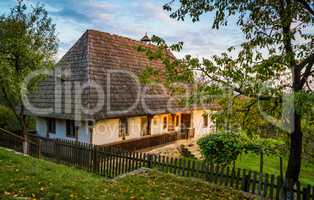 Ukrainian traditional village house at autumn.