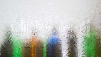 Blurred defocused bottles abstract background.