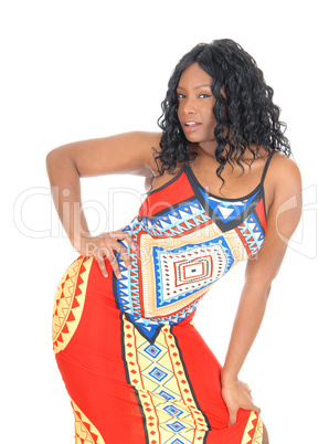 African woman standing in dress.