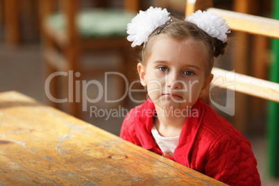 Little girl in a red jacket