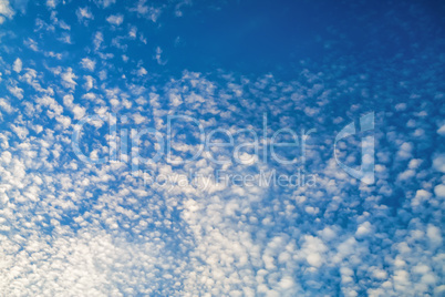 Small clouds against blue sky