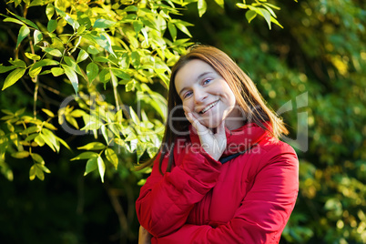 Smiling woman in a red jacket