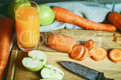 glass of fresh juice of carrots and apples