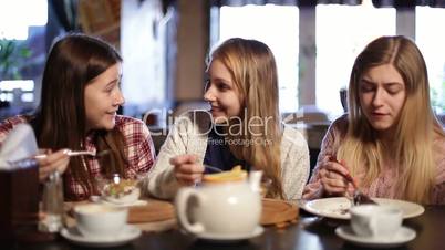 Attractive girlfriends chilling out at restaurant