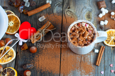 white cup with a drink on the wooden surface