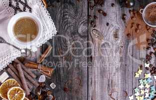Grey wooden background with black coffee