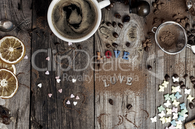 Coffee and an inscription love the gray wooden surface